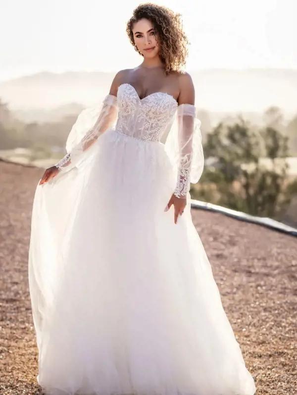 Model wearing a white Allure Bridals gown