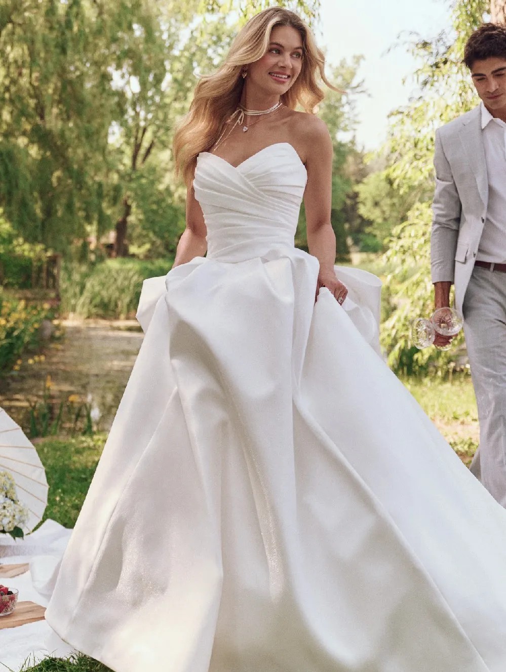 Model wearing a white Maggie Sottero gown